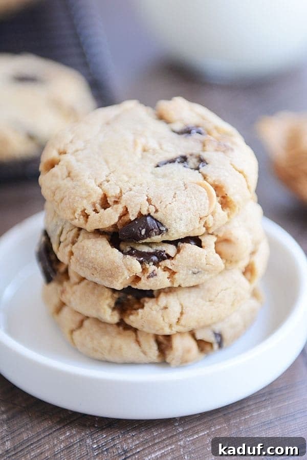 A stack of delicious chocolate chip peanut butter cookies in a white ramekin.