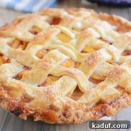 Summertime Peach Pie Perfection 8 Delicious fresh peach pie, ready to be served.