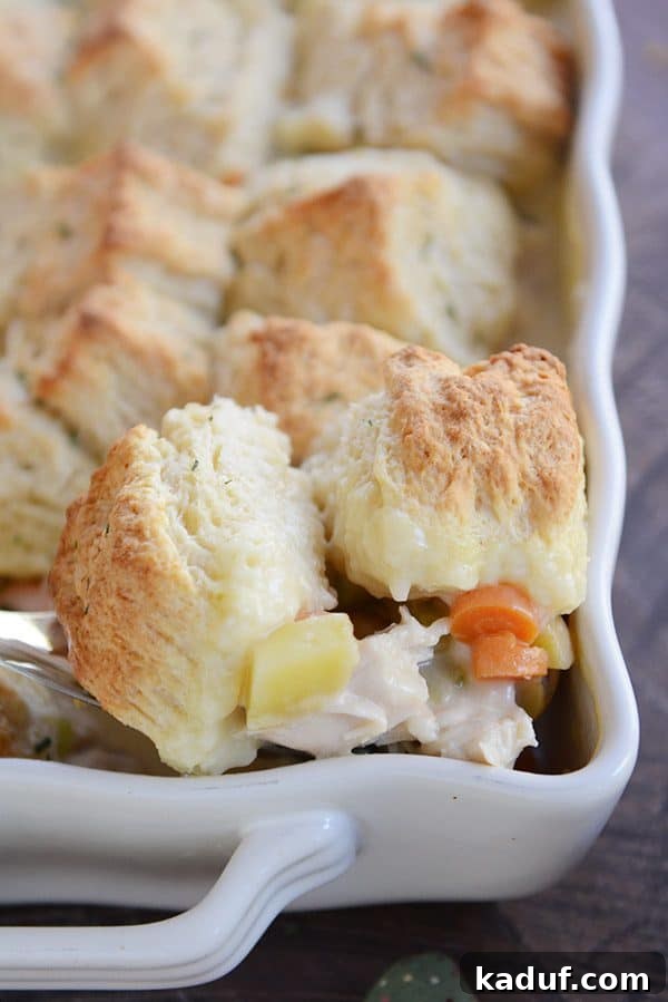 Savory Chicken or Turkey Pot Pie Perfection 3 A rustic white casserole dish filled with golden-crusted chicken pot pie, fresh from the oven.