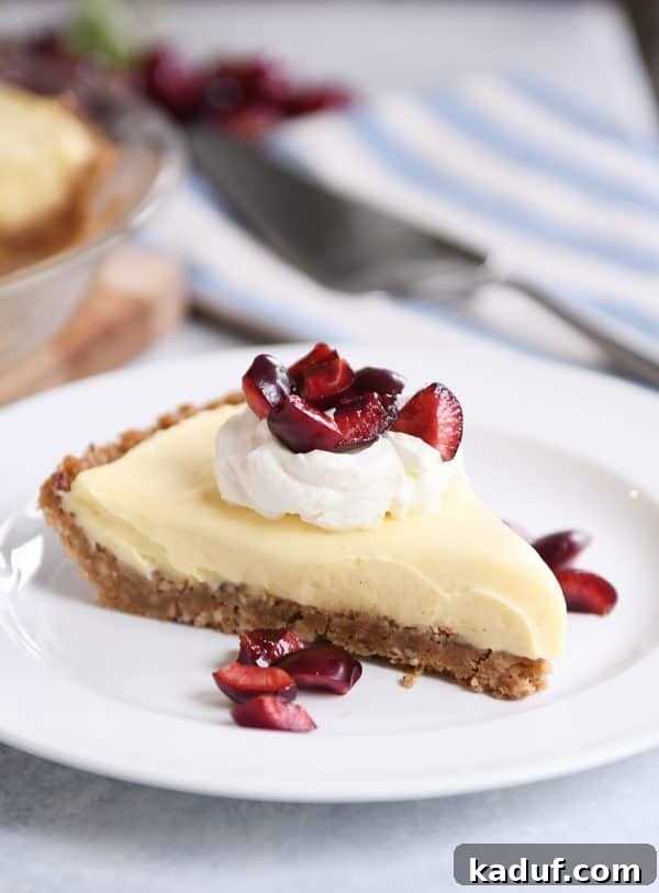 Creamy Berry Delight Pie with Toasted Pecan Graham Crust 4 Berries and cream pie with cherries on top.