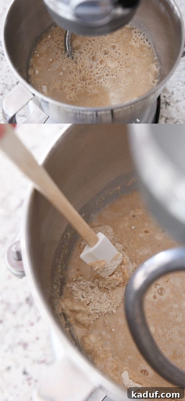 Effortless KitchenAid Small Batch Soft Fluffy Whole Wheat Bread 6 Water and yeast getting mixed into a KitchenAid bowl of whole wheat bread dough, creating an active starter.