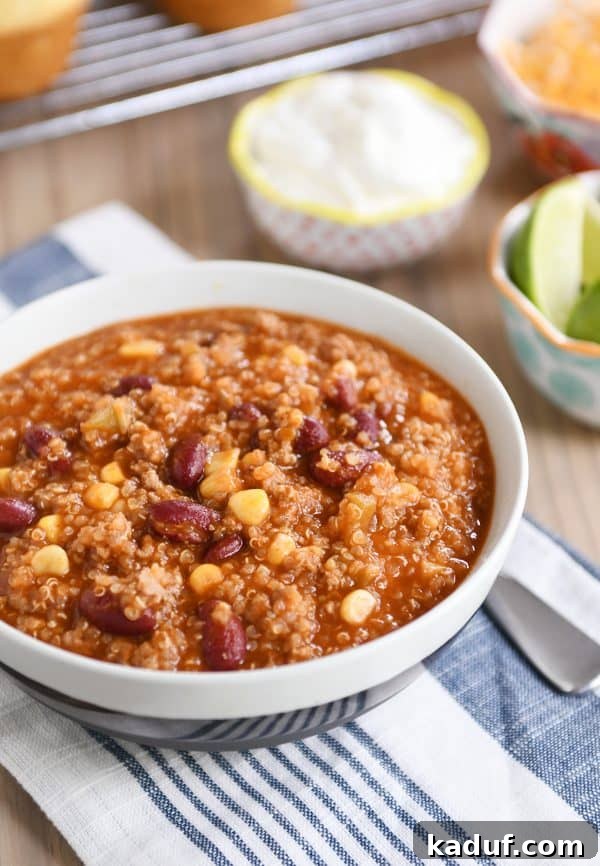 Versatile Quinoa Red Bean Chili Instant Pot and Slow Cooker 3 Stone bowl filled with delicious and hearty quinoa red bean chili, garnished with fresh herbs.