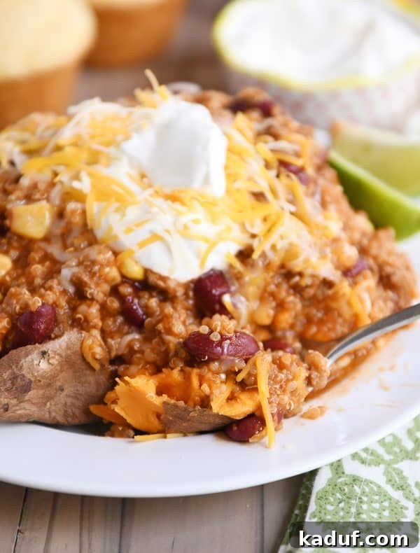 Versatile Quinoa Red Bean Chili Instant Pot and Slow Cooker 6 Forkful of baked sweet potato with a scoop of Instant Pot quinoa red bean chili, showcasing its hearty texture.