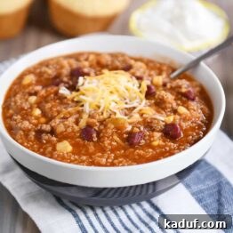 Versatile Quinoa Red Bean Chili Instant Pot and Slow Cooker 7 Stone bowl of delicious Instant Pot quinoa red bean chili, topped with cheese.