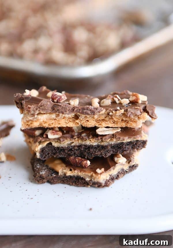 Peanut Butter Chocolate Graham Cracker Bark 2 Stack of easy graham cracker toffee with peanut butter and chocolate layers, ready to be enjoyed.