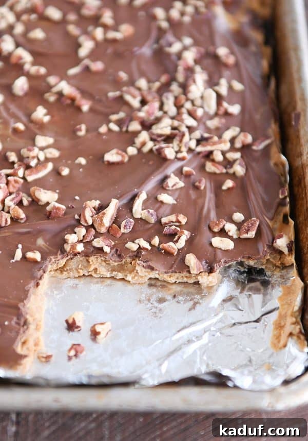 Peanut Butter Chocolate Graham Cracker Bark 3 A sheet pan of easy graham cracker toffee with a few irresistible pieces already missing.