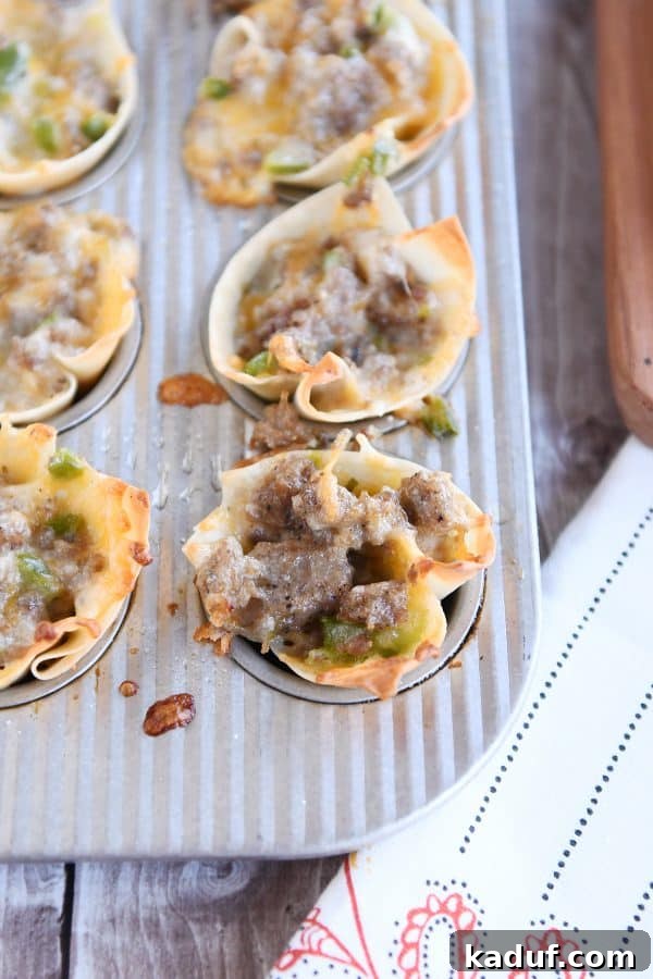 Crispy Cheesy Sausage Wontons 3 A mini muffin tin filled with raw wonton wrappers, ready to be filled with the cheesy sausage mixture.