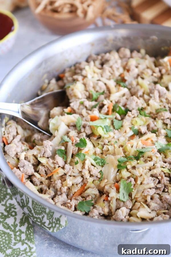 Deconstructed Egg Roll Skillet 3 Egg roll skillet meal ready to serve in a stainless steel pan.