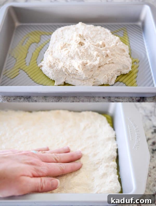 Super Simple Hand Mixed Focaccia 5 Pressing easy focaccia bread dough into pan.