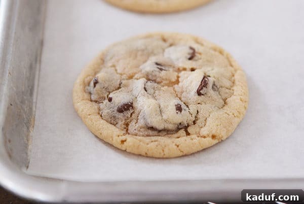 Friday Flash Thoughts 4 A plate of perfectly baked, super soft chocolate chip cookies, stacked and inviting, a classic comfort food.