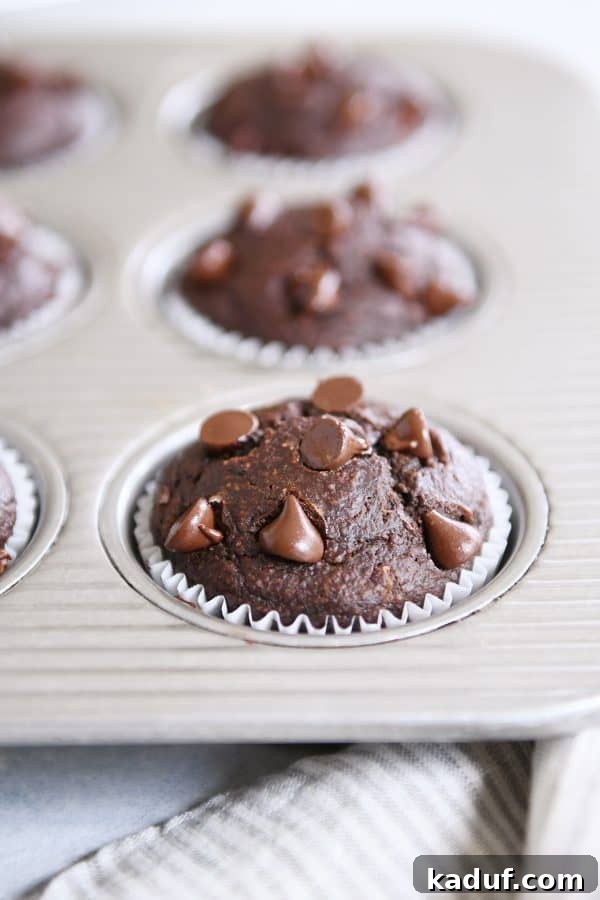 Gluten-Free Double Chocolate Banana Blender Muffins 7 Double chocolate banana blender muffin in metal tin.