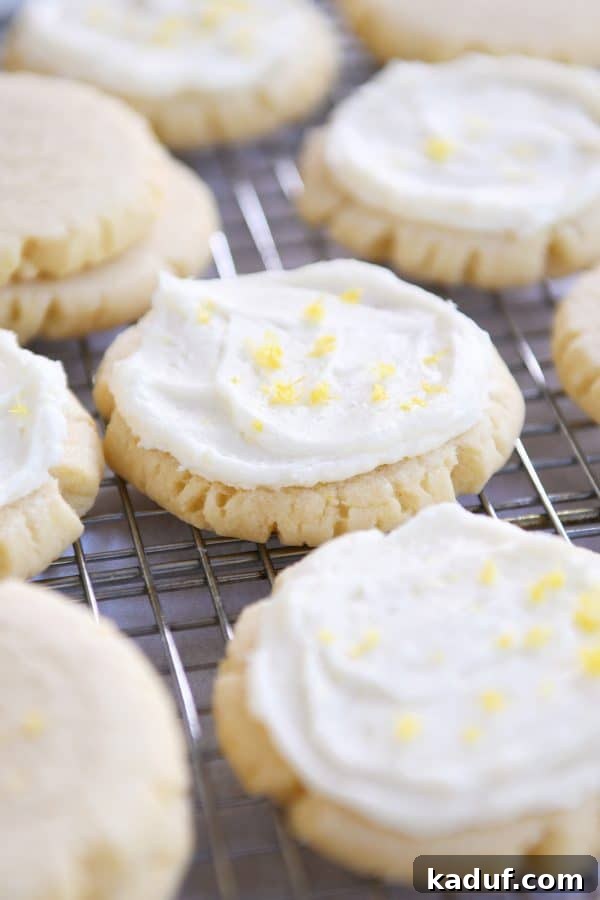 Frosted lemon swig sugar cookies on wire cooling rack.