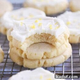 Bite taken out of frosted lemon swig sugar cookies.