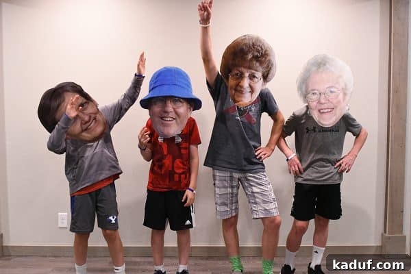 Friday Focus: Mastering the Summer Months 11 Kids performing a humorous bobblehead skit using large cutout photos, creating a comical effect.