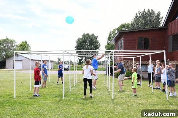 Friday Focus: Mastering the Summer Months 8 A group of people enthusiastically playing an outdoor game, showcasing the fun and energy of family activities.