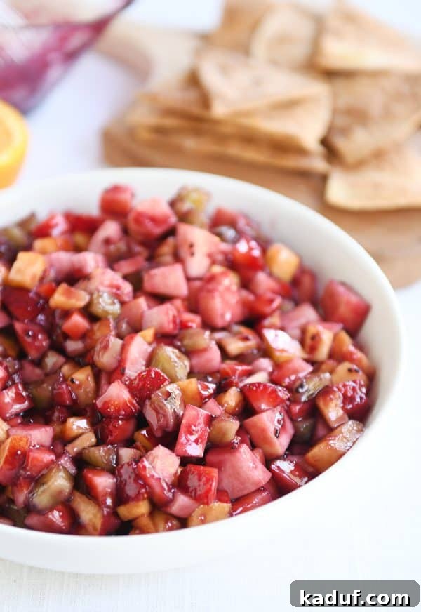 Vibrant Fruit Salsa with Honey-Kissed Cinnamon Crisps 2 White shallow bowl with mixed fruit salsa.