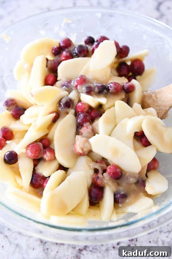 Thanksgivings Beloved Apple Cranberry Pie 8 Apples and cranberries mixed with caramel sauce for pie.