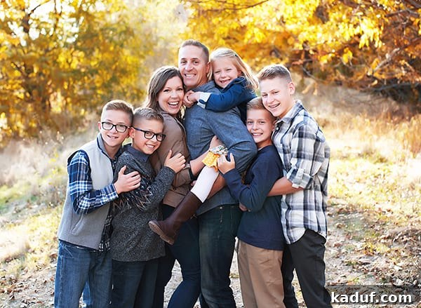 Joyful Holiday Season 2 Family laughing together, symbolizing joy and imperfections of a challenging year