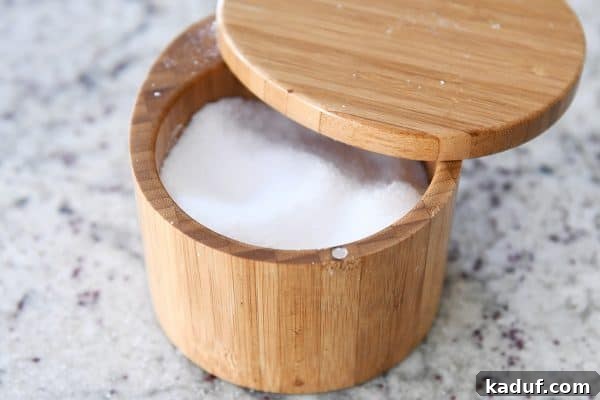 5 Kitchen Secrets to Instantly Become a Better Cook 3 A simple yet elegant depiction of coarse kosher salt in a salt cellar, ready for seasoning.