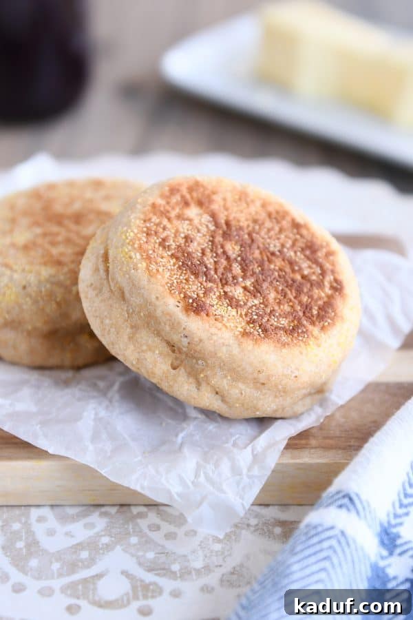 Easy homemade english muffins on parchment paper.
