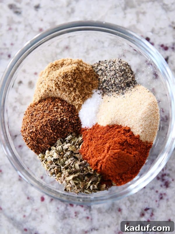 Tender BBQ Pork Tacos Instant Pot Slow Cooker Friendly 3 A close-up shot of a homemade spice blend, perfectly mixed for Instant Pot BBQ pork tacos, featuring rich red paprika, earthy cumin, and fragrant oregano.