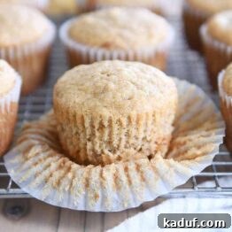 unwrapped banana muffin on wire rack