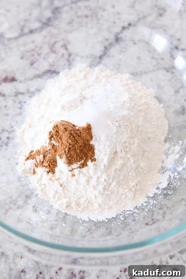 Irresistible Banana Muffins 5 A glass bowl holds the pre-mixed dry ingredients for delicious banana muffins.