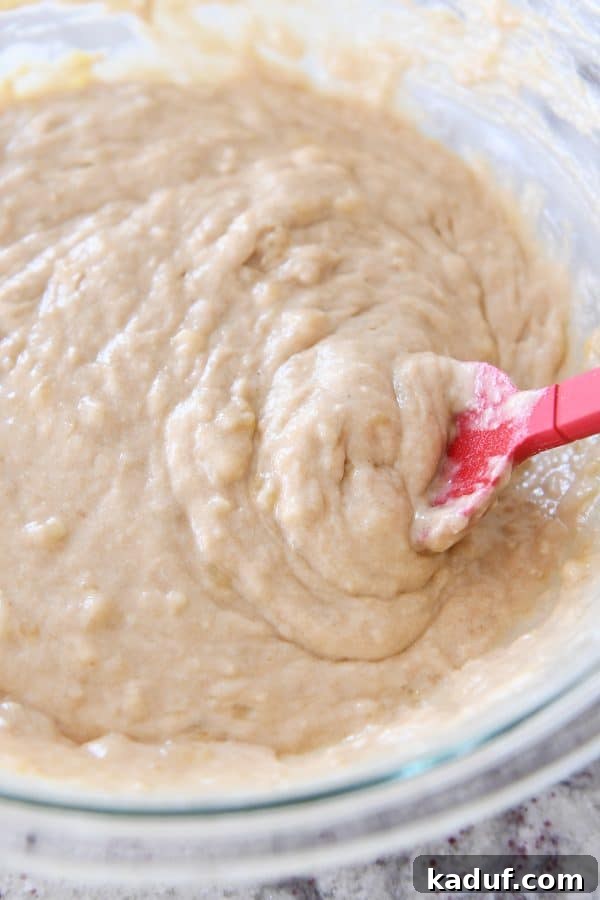 Irresistible Banana Muffins 8 A bowl containing the freshly mixed batter for the best banana muffins, ready for baking.