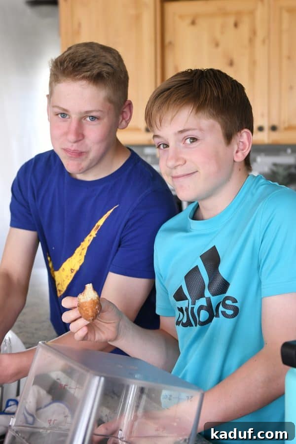 Melt-in-Your-Mouth Homemade Glazed Donuts 4 Two smiling teenage boys eagerly testing the best homemade glazed donuts recipe, highlighting their universal appeal.