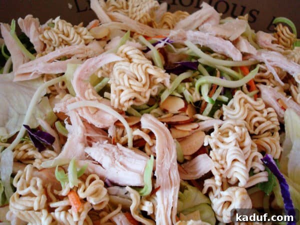 Sesame Ginger Chicken Salad 3 A large, inviting bowl filled with colorful Asian Chicken Salad, perfectly assembled and ready to be tossed.