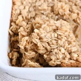 A square image of Easy Amish Baked Oatmeal, beautifully presented and ready to be served.