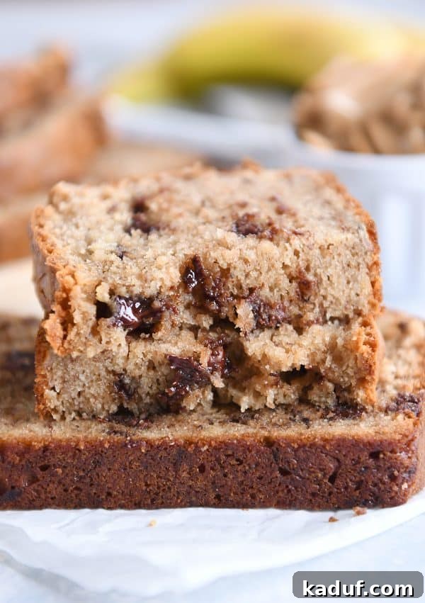 Ultimate Peanut Butter Banana Bread 2 Three slices of peanut butter banana bread on white napkin.