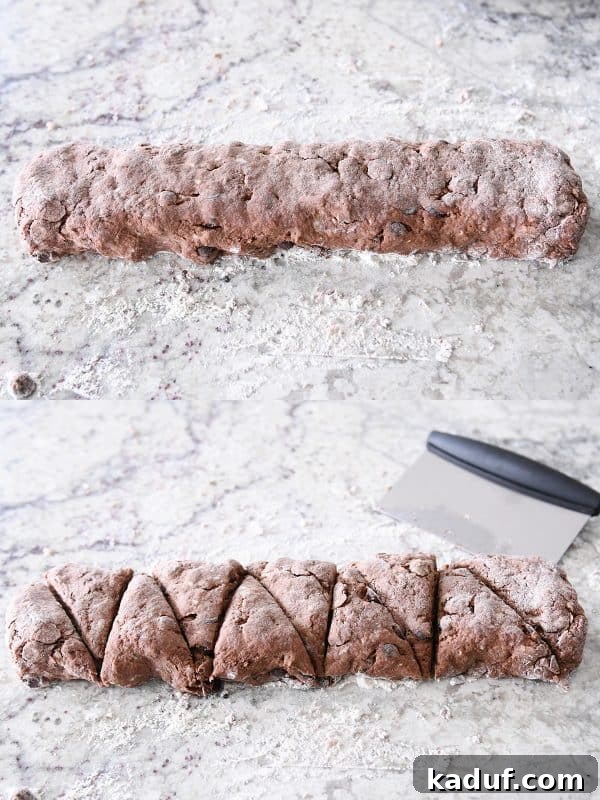 Divine Triple Chocolate Scones 7 Hands shaping chocolate scone dough into a rectangle and then cutting it into perfect triangles on a lightly floured surface.
