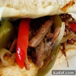 Close-up of a French Dip sandwich ready for dipping in au jus
