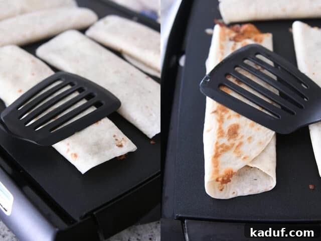 Ultimate Crispy Chicken Bacon Ranch Wraps 6 Crispy chicken bacon ranch wrap on griddle pressed with spatula.