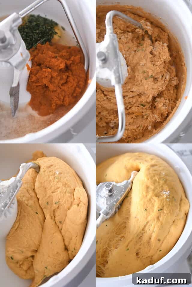 Aromatic Pumpkin Rosemary Rolls 4 A white Bosch stand mixer diligently kneading dough for pumpkin dinner rolls, showcasing the blending process.