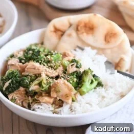Effortless Chinese Chicken Broccoli Stir-Fry 5 naan bread in white bowl with rice, chicken, broccoli and brown sauce