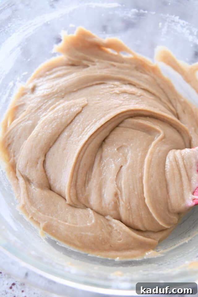 Cinnamon Roll Blondie Bars 3 Cinnamon roll blondie cookie batter in glass bowl.