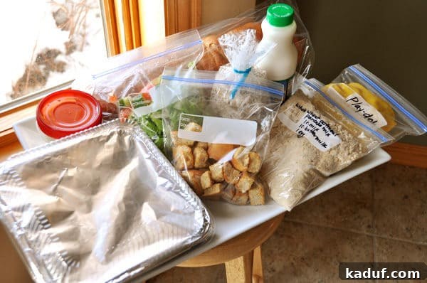 New Mom's Comfort Tray 2 a big white tray full of various bagged foods and sides to use as a take-in meal, ready for delivery