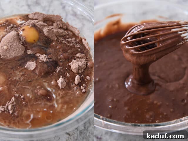 Next-Level Chocolate Cake Perfection 5 A close-up view of dark chocolate cake batter being expertly mixed with a whisk in a clear glass bowl, showcasing its smooth, consistent texture.