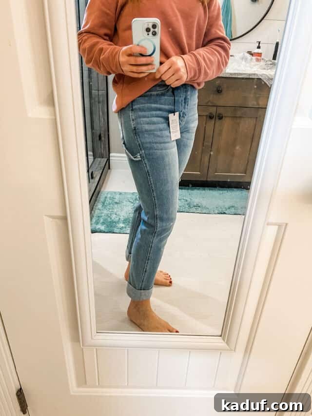 Friday Focus Favorite Finds and Fresh Updates 3 Woman in mirror with jeans and sweatshirt.