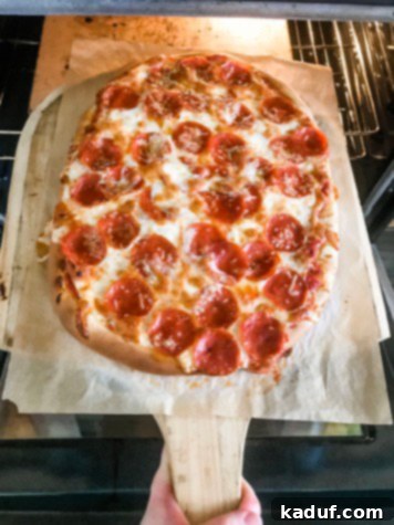 Friday Musings 2 Homemade pizza on wooden pizza peel.