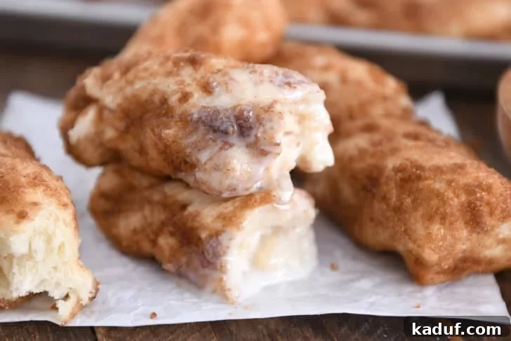 Fluffy Cinnamon Sugar Knots 2 Two half cinnamon twists dipped in icing and stacked on each other. These buttery cinnamon sugar twists are unbelievably delicious. Easier than cinnamon rolls, they are soft, fluffy and delicious plain or with a bit of sweet icing!