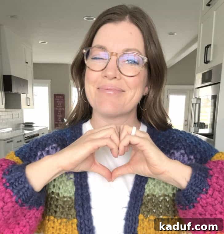 Friday Musings: Gratitude, Inquiry, and Simple Pleasures 6 Mel holding up hand heart.