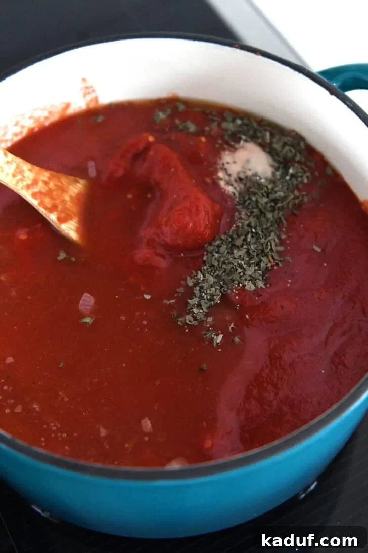 The Ultimate Tomato Soup Experience 4 Tomatoes, basil, baking soda, and broth in a pot