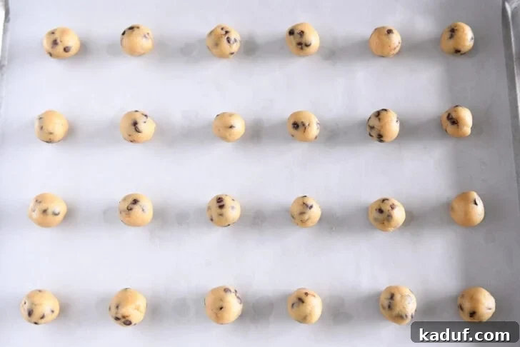 Tiny Chocolate Chip Delights 7 Unbaked mini cookie dough balls on parchment
