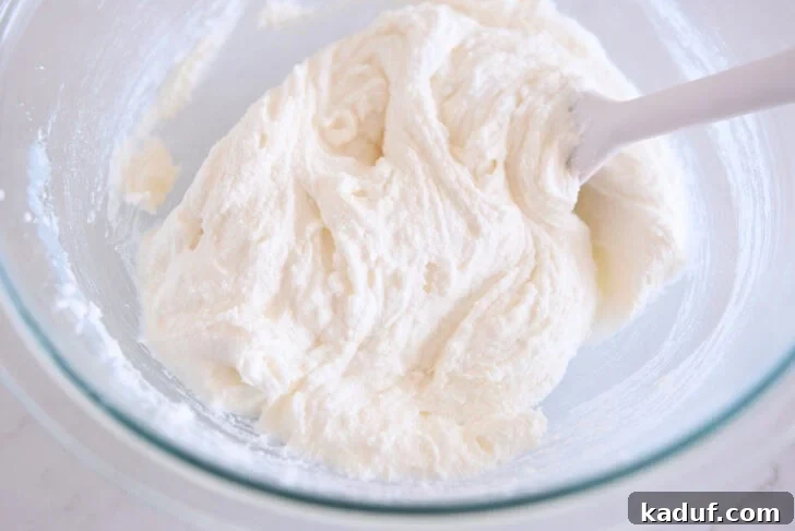 Grandma's Secret Sheet Cake Recipe 4 Creamed butter, oil, and sugar in a glass bowl.