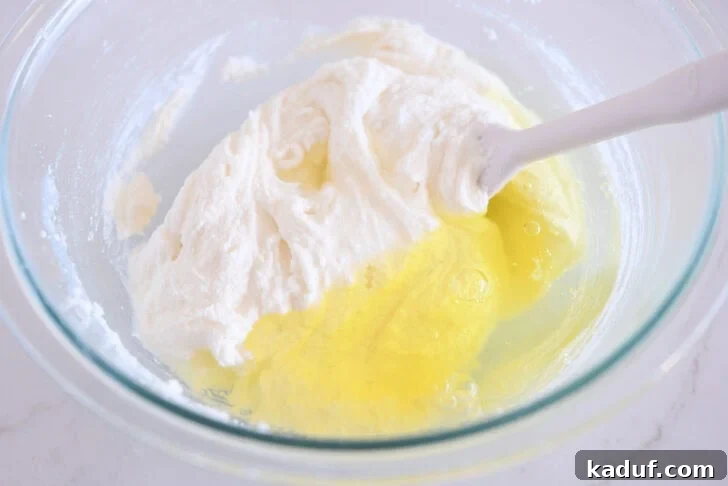 Grandma's Secret Sheet Cake Recipe 5 Egg whites being added to the cake batter.