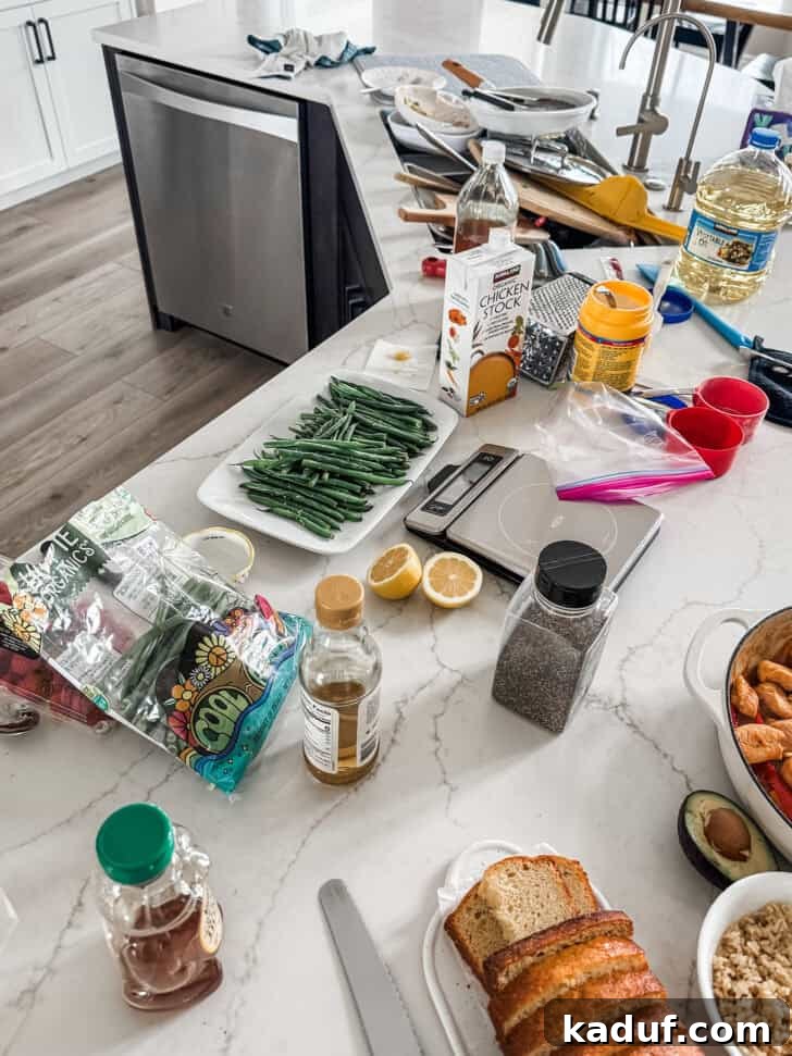 Friday Musings 11 A messy kitchen counter with a sink full of dishes. The reality of home cooking.