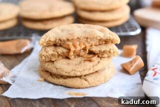two brown butter caramel snickerdoodles stacked with one cookie broken in half on top